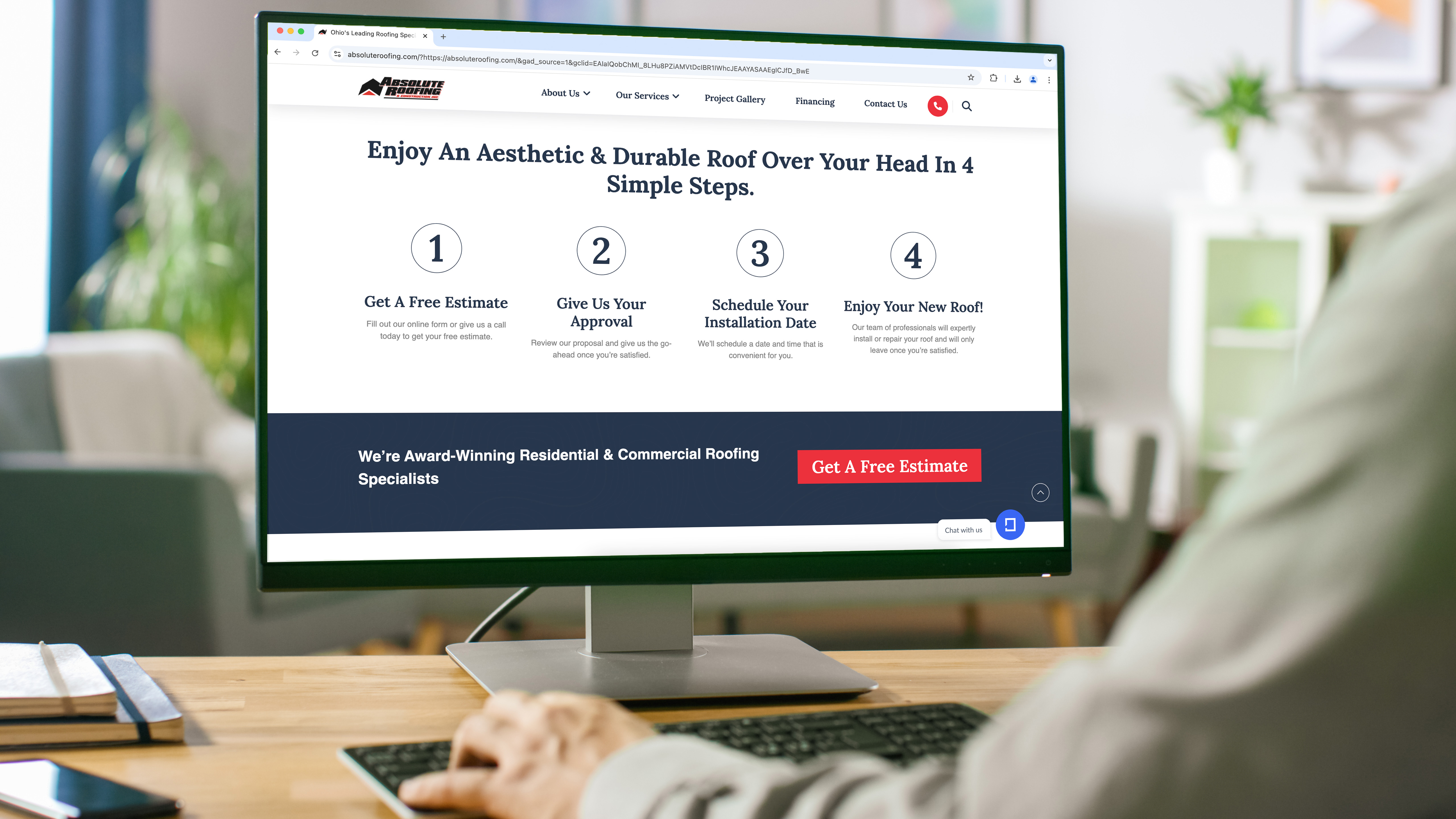 A view of a desktop computer screen showing the Absolute Roofing and Construction website A view of a desktop computer screen showing the Absolute Roofing and Construction website