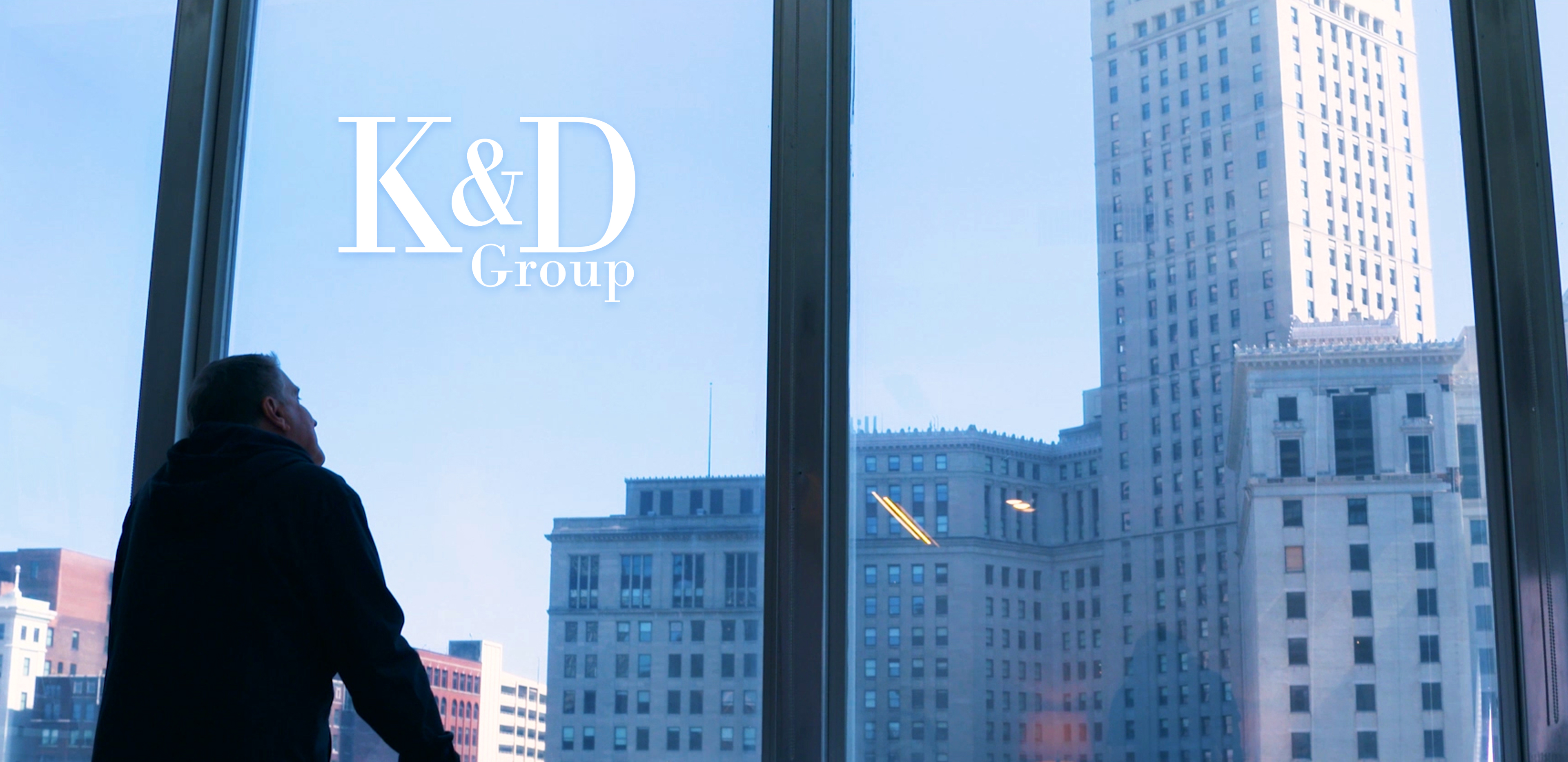 Man looking out of the window of his K&D apartment Man looking out of the window of his K&D apartment